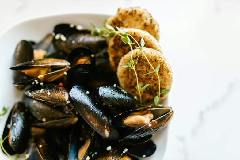 a bowl of mussels and potatoes on a table, pexels contest winner, crisp details, seeds, steamboat willy, thumbnail