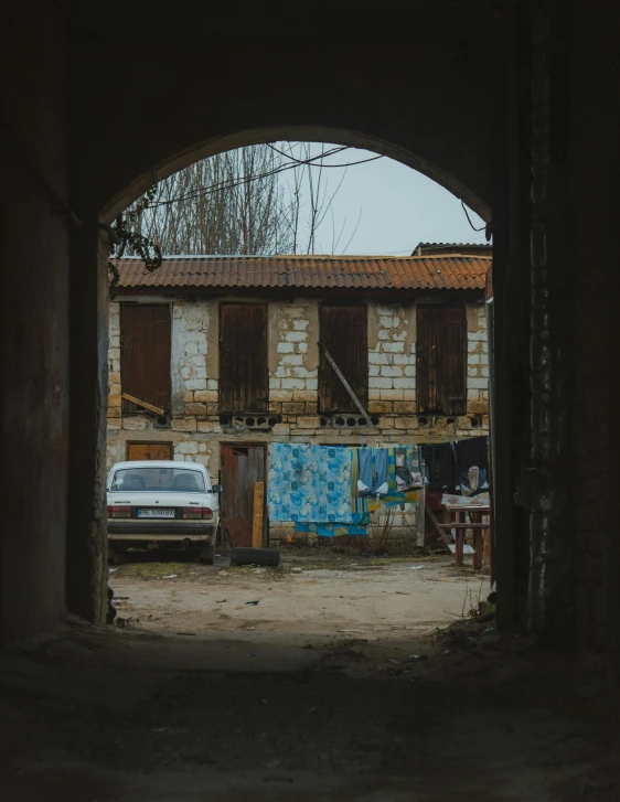 a car that is sitting inside of a building, by Kristian Zahrtmann, small village, 8 k image