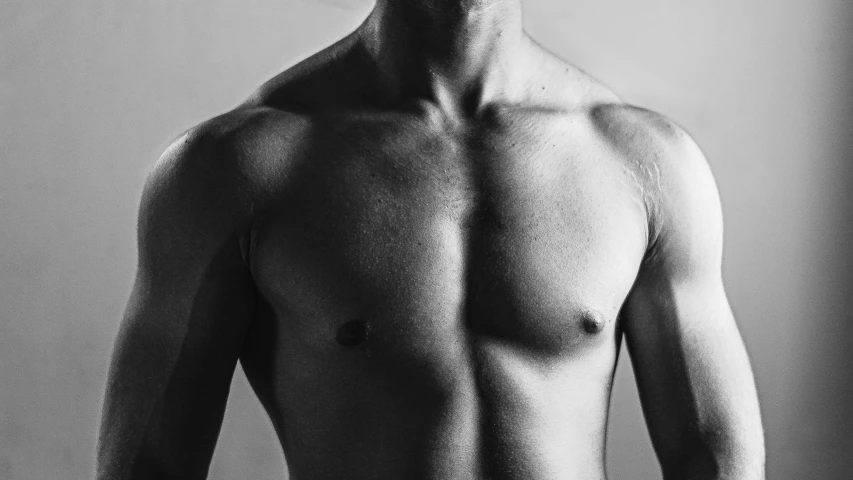 a black and white photo of a shirtless man, a black and white photo, pexels, digital art, chest high, augmentation, decollete, 30 year old man :: athletic