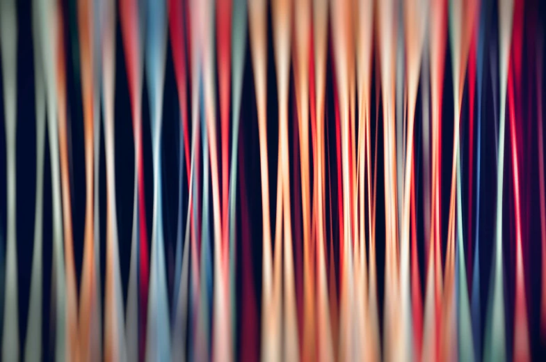 a blurry photo of multicolored lines, by Jan Rustem, rows of razor sharp teeth, red orange blue beige, abstract illustration, background made of big curtains