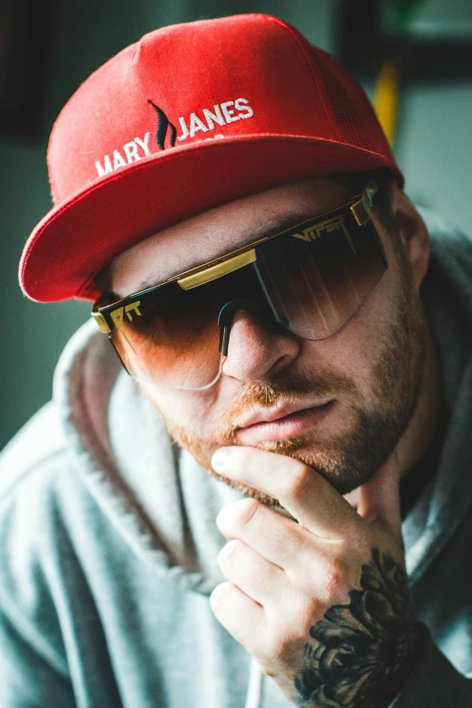 a man wearing a red hat and sunglasses, inspired by Károly Brocky, graffiti, wearing gold glasses, bam margera, (((rusty))), professional photo