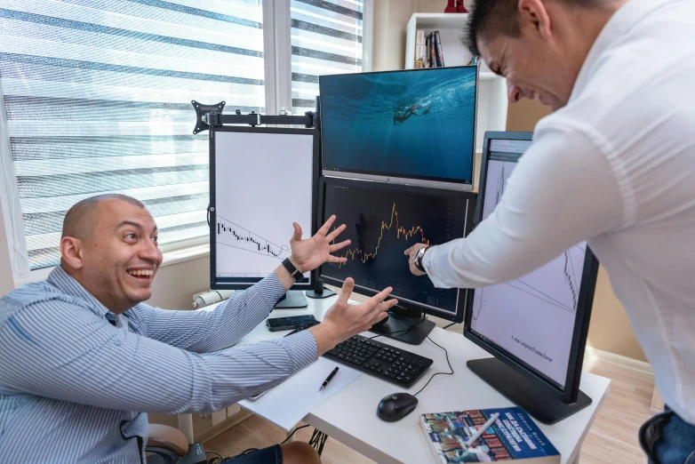 a couple of men that are sitting in front of a computer, pexels contest winner, analytical art, displaying stock charts, subreddit / r / whale, excited expression, pov photo