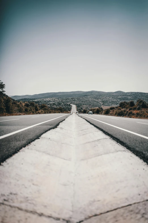 an empty road in the middle of nowhere, a picture, unsplash contest winner, postminimalism, hills in the background, 🚿🗝📝, asphalt and metal, small steps leading down