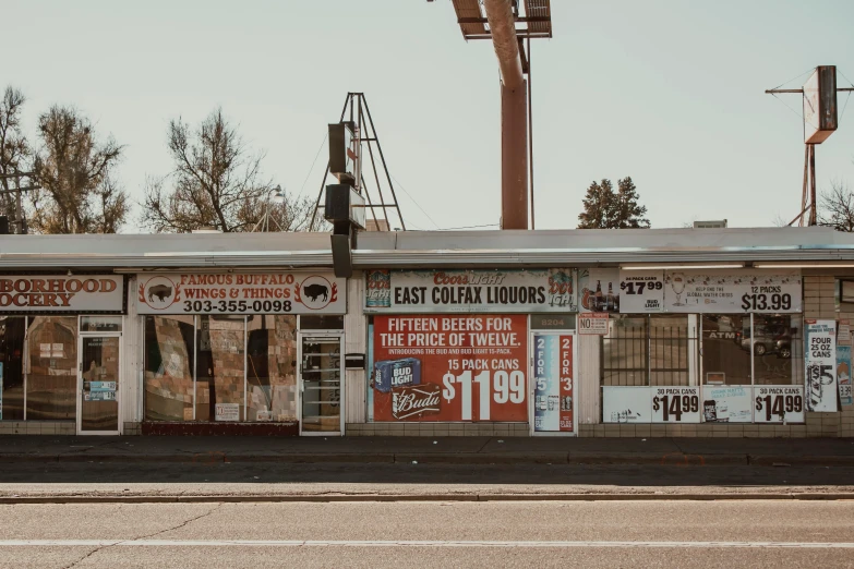 a store sitting on the side of a road, pexels contest winner, 1600 south azusa avenue, poster shot, booze, tan