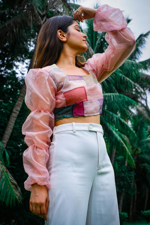 a woman standing on top of a lush green field, an album cover, inspired by Jacopo Bellini, trending on pexels, renaissance, wearing crop top, made of cotton candy, patchwork, see - through