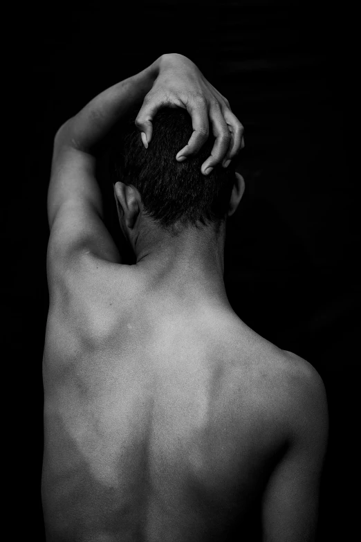 a black and white photo of a man with his hands on his head, inspired by Robert Mapplethorpe, pexels contest winner, renaissance, showing her shoulder from back, sores and scars, dark dance photography aesthetic, man is with black skin