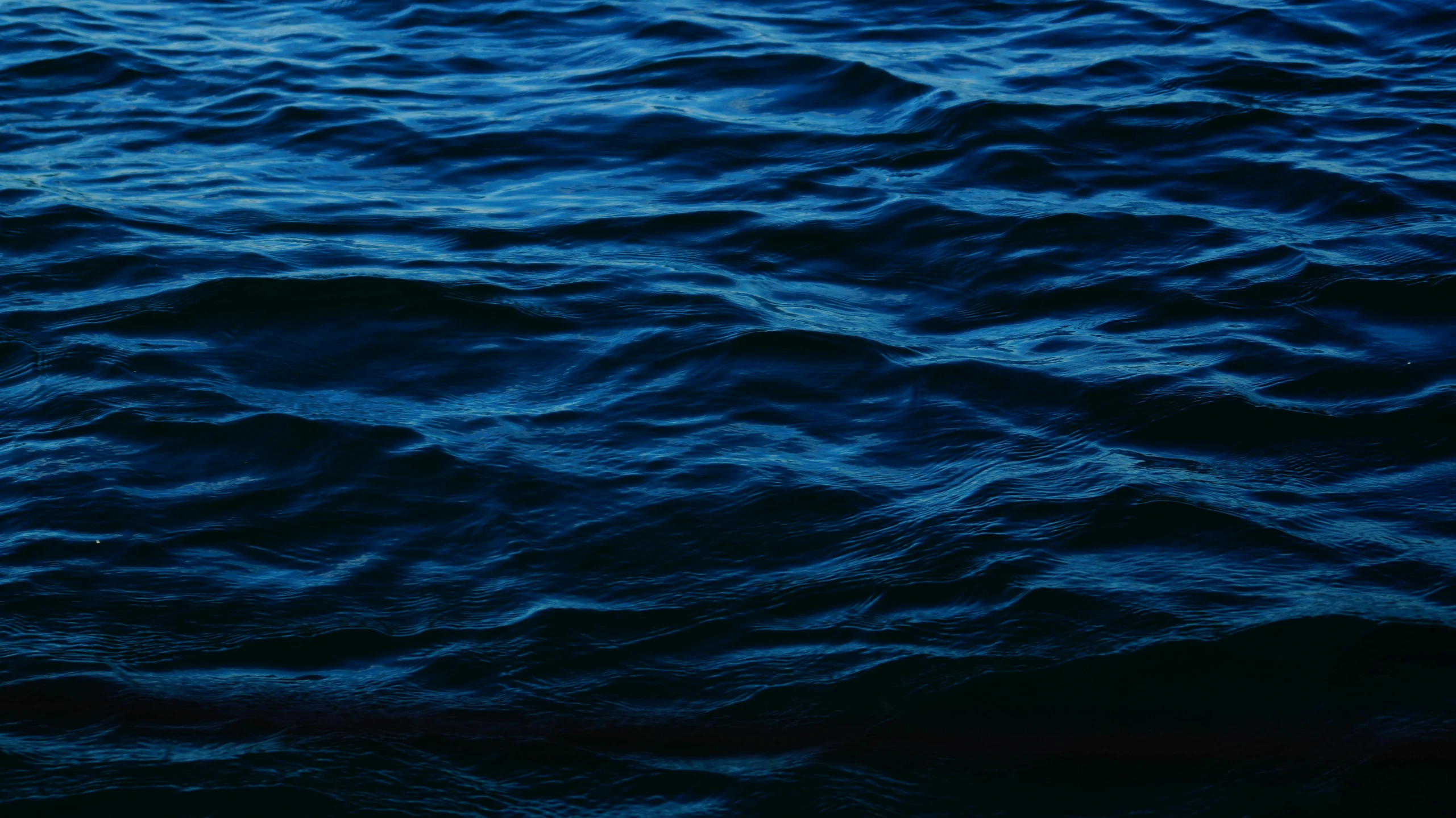 a close up of a body of water with waves, an album cover, by Elsa Bleda, unsplash, midnight blue, ignant, blue-black, hd wallpaper