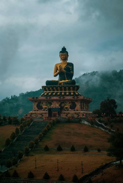 a large buddha statue sitting on top of a hill, by Carey Morris, pexels contest winner, sumatraism, square, assamese aesthetic, chinese building, 256435456k film