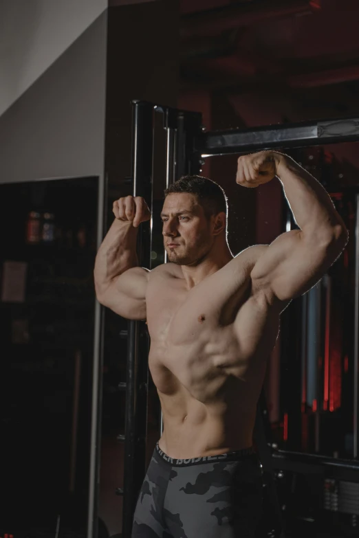 a man flexing his muscles in a gym, a screenshot, by Adam Rex, pexels contest winner, renaissance, jaroslaw jasnikowski, tall and muscular, adult man, male character