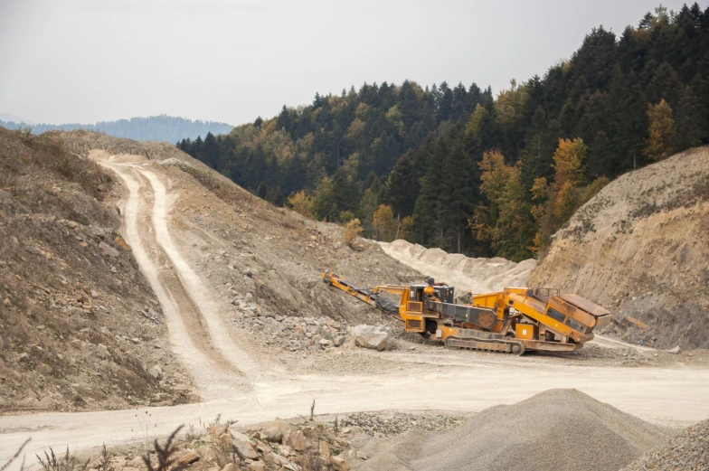 a couple of trucks that are sitting in the dirt, large mountain, avatar image, industrial machinery, opening shot