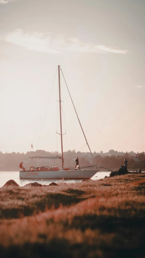 a sail boat sitting on top of a body of water, an album cover, pexels contest winner, vintage color photo, late summer evening, today\'s featured photograph 4k, canvas