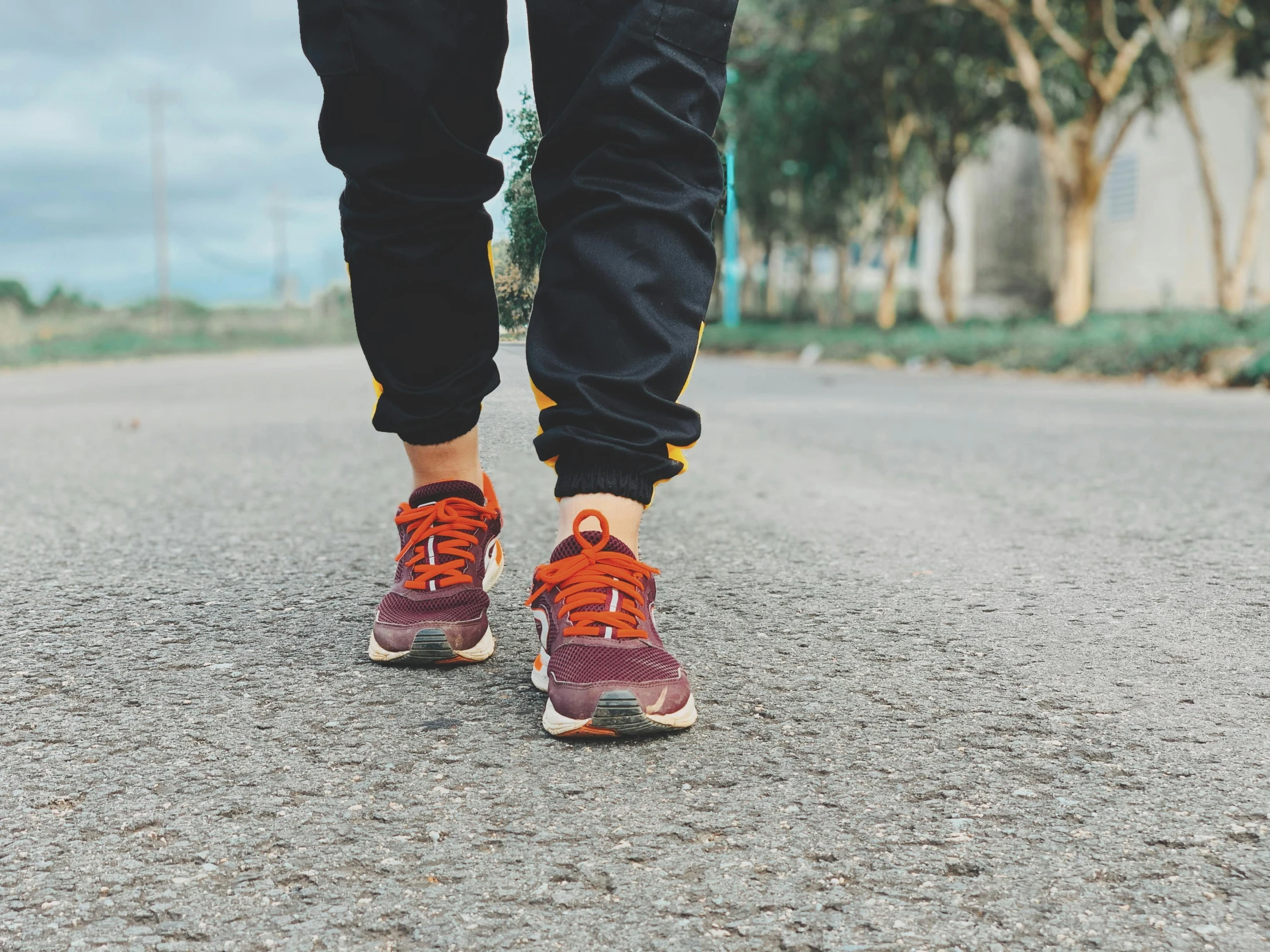 a close up of a person walking on a road, 5k, on the ground, avatar image, sport clothing