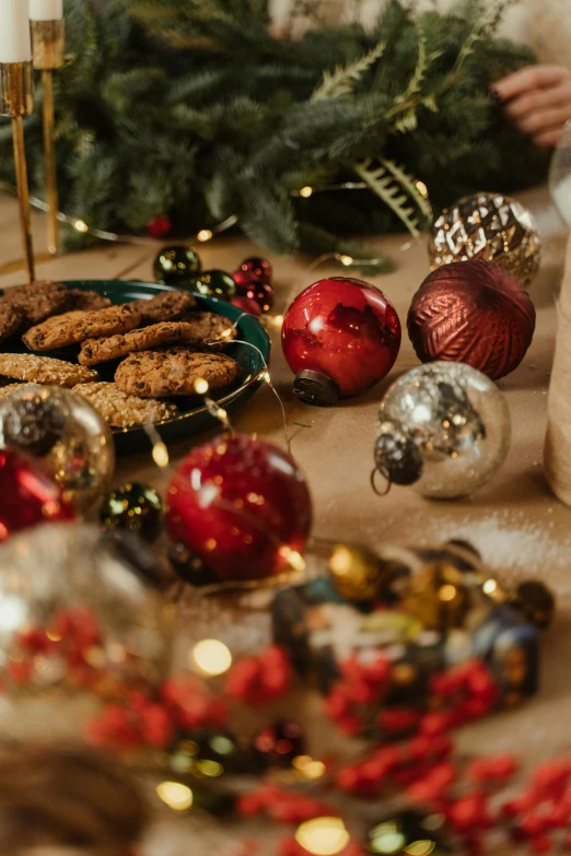 a close up of a plate of food on a table, a still life, inspired by Ernest William Christmas, trending on pexels, decorated ornaments, cookies, metallic flecks, red brown and blue color scheme