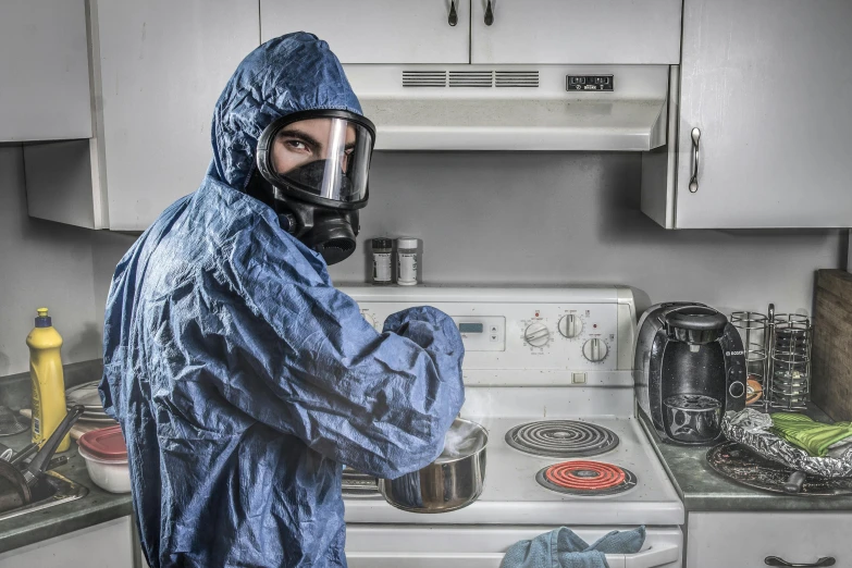 a man wearing a gas mask in a kitchen, trending on reddit, plasticien, wearing blue robe, crime scene photo, istockphoto, full body armour