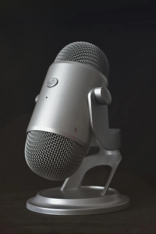 a silver microphone sitting on top of a table, trending on zbrush central, gaming headset, 3 d render n - 9, documentary photo, - n 9