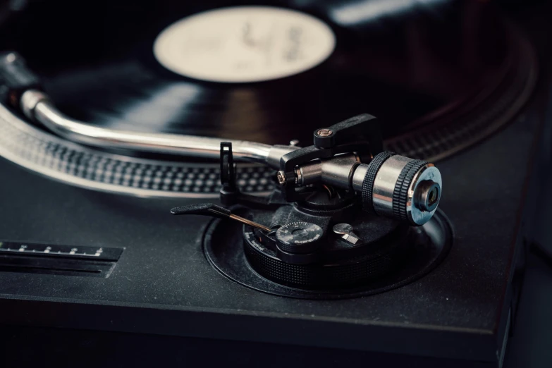 a close up of a record player's turntable, trending on pexels, private press, instagram post, shot on canon eos r 5, various styles, a high angle shot