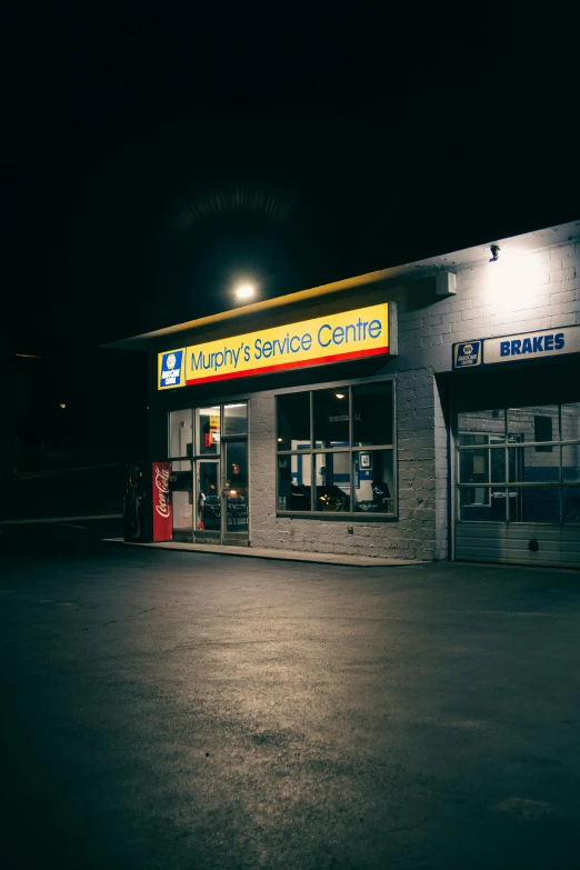 a gas station is lit up at night, by Matt Cavotta, hurufiyya, vhs colour photography, crescent wrench, profile image
