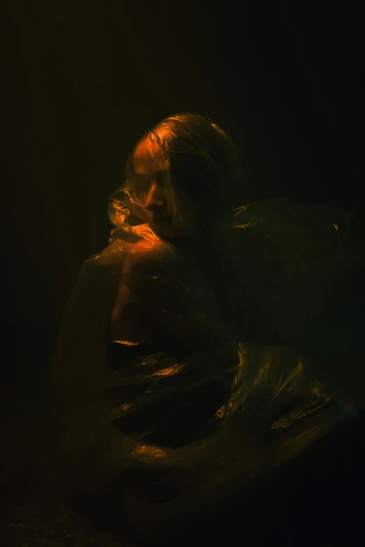 a woman sitting on top of a bed under a light, an album cover, inspired by Elsa Bleda, art photography, dressed in plastic bags, swirling fluid smokey enigma, against a deep black background, ignant