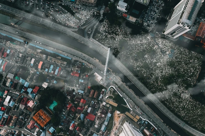 an aerial view of a city with lots of buildings, a matte painting, pexels contest winner, scattered rubbish and debris, overpass, unsplash transparent fractal, tear gas