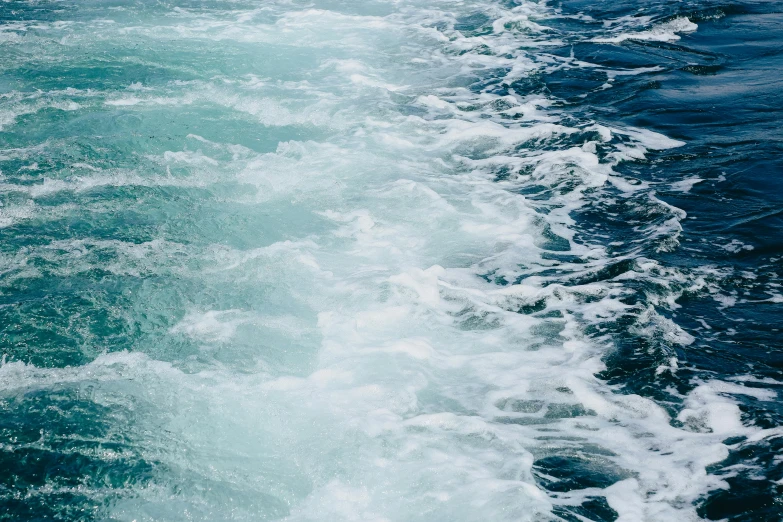 a person riding a surf board on top of a body of water, unsplash, process art, ship at sea, turbulence, blue and green water, close together