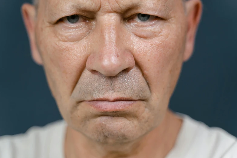 a man with a concerned look on his face, unsplash, hyperrealism, wrinkly forehead, high quality photo, extremely realistic photo, grumpy [ old ]