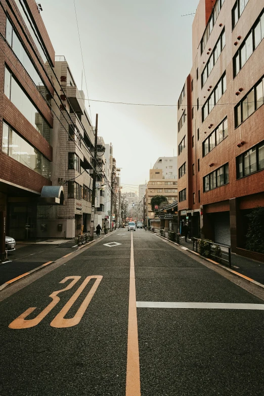 an empty city street lined with tall buildings, a picture, unsplash, shin hanga, old city, instagram photo, mid - 3 0 s, multiple stories