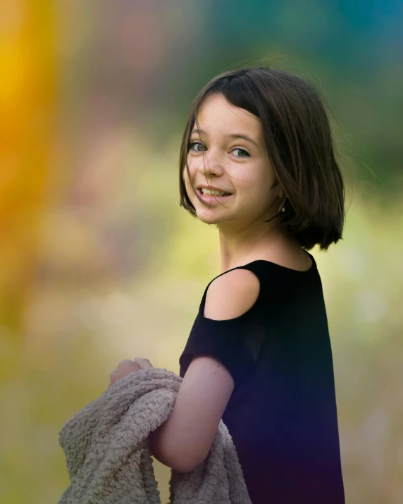 a little girl holding a teddy bear in a field, inspired by William-Adolphe Bouguereau, pexels contest winner, she is wearing a black tank top, portrait happy colors, standing under a beam of light, portrait of arya stark