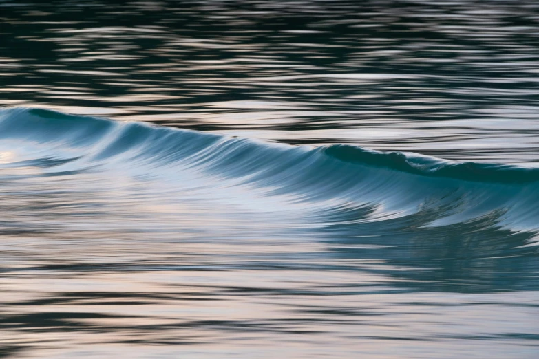 a man riding a wave on top of a surfboard, by Andrew Geddes, unsplash contest winner, tonalism, reflective gradient, flowing aqua silk, early morning light, curved lines