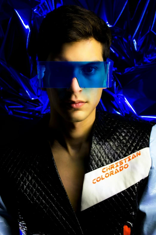 a close up of a person wearing a vest and glasses, an album cover, inspired by Maximilian Cercha, futurism, male model, colorado, official photo, light show