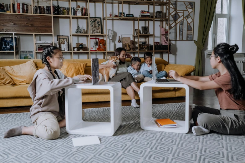 a woman sitting on the floor playing a video game, a cartoon, by Julia Pishtar, pexels contest winner, incoherents, group sit at table, families playing, furniture and decor, concept photo