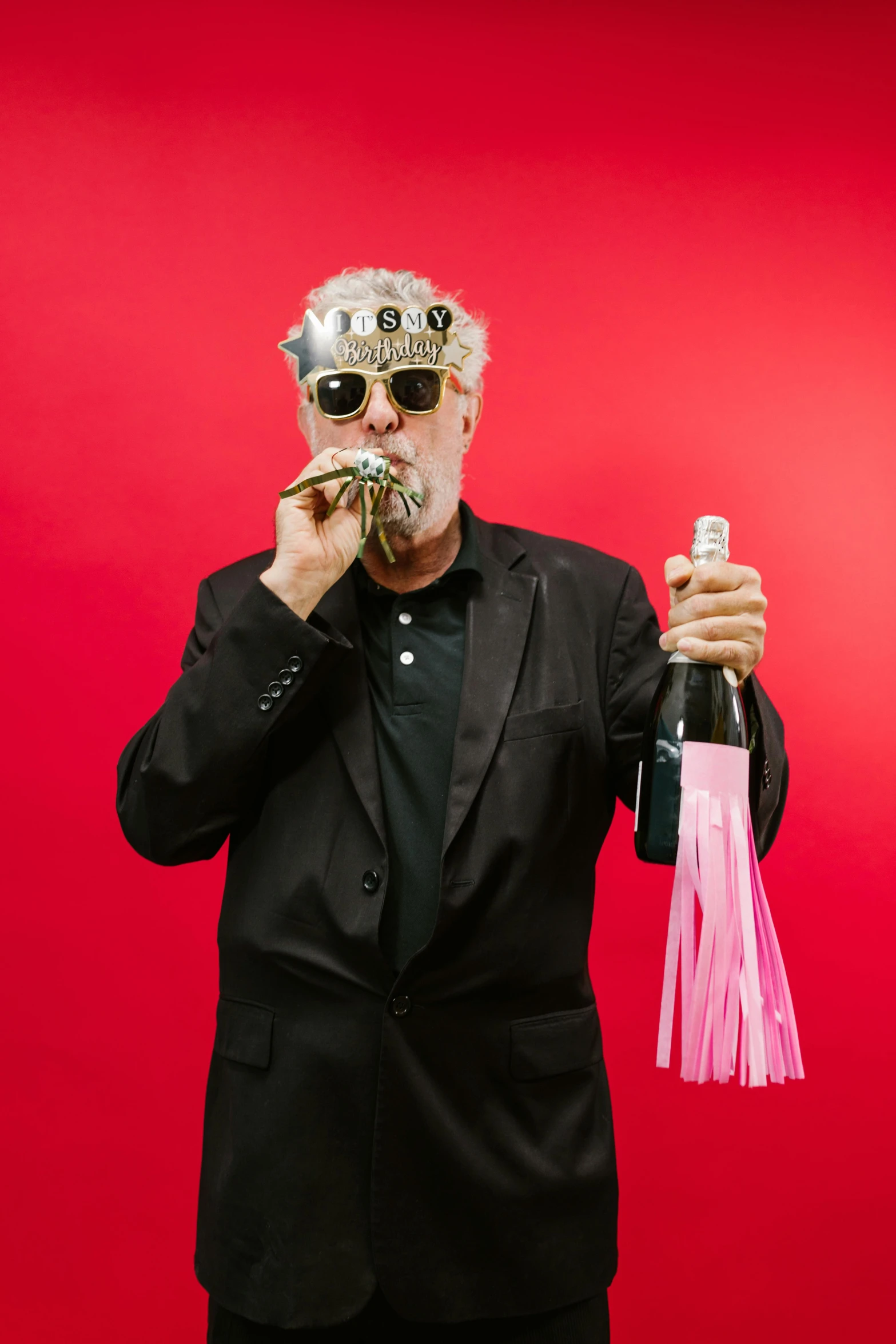 a man in a suit and sunglasses holding a bottle of wine, an album cover, unsplash, neo-dada, very long silver beard, new years eve, pink, guy fieri