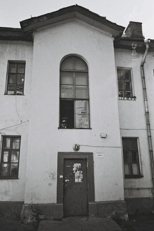 a black and white photo of a building, fluxus, street of moscow, windows and walls :5, 1990s photograph, photo”
