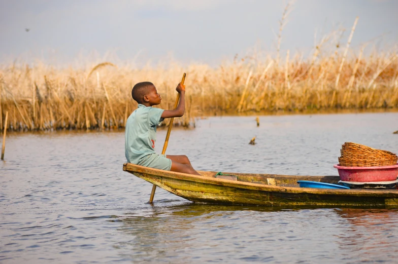 a person in a boat on a body of water, by Joseph Severn, pexels contest winner, hurufiyya, obunga, marsh, 5 years old, slide show