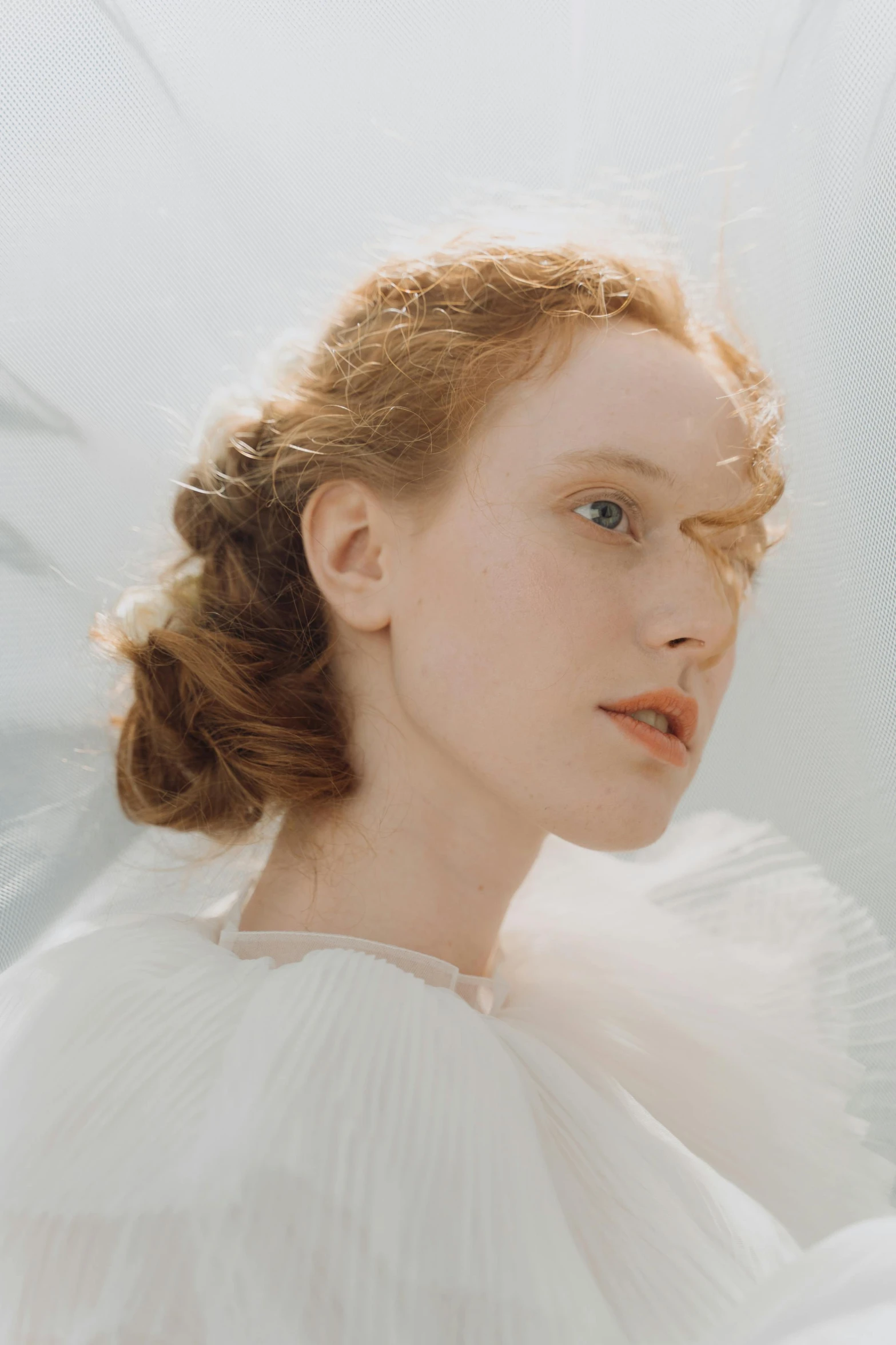 a woman in a white dress posing for a picture, an album cover, inspired by Alexandre Cabanel, ginger hair with freckles, ethereal soft and fuzzy glow, ignant, pale skin!