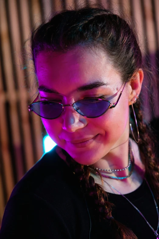 a close up of a person using a cell phone, an album cover, inspired by Ion Andreescu, spiked collar sunglasses, vivid lighting, miranda cosgrove, profile image