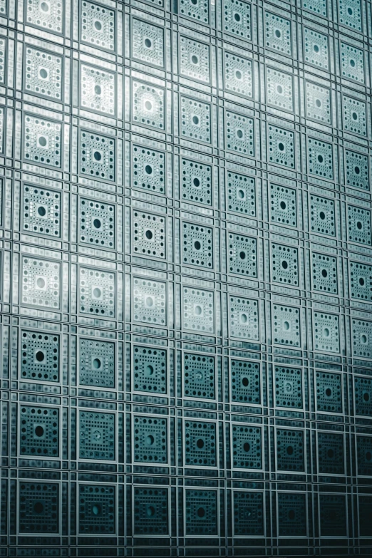 a man standing in front of a glass wall, an album cover, inspired by Andreas Gursky, unsplash, modernism, metallic patterns, perfectly tileable, islamic art, square