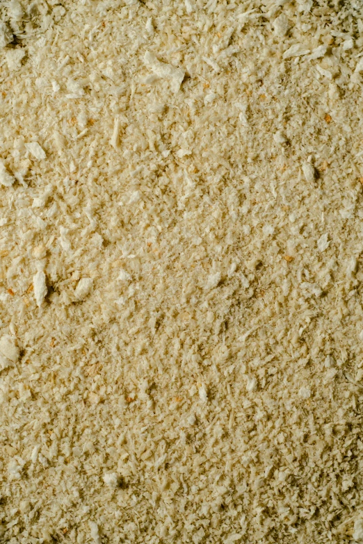 a pile of sand sitting on top of a table, a macro photograph, reddit, detailed product image, yellowing wallpaper, high angle close up shot, ground - level medium shot