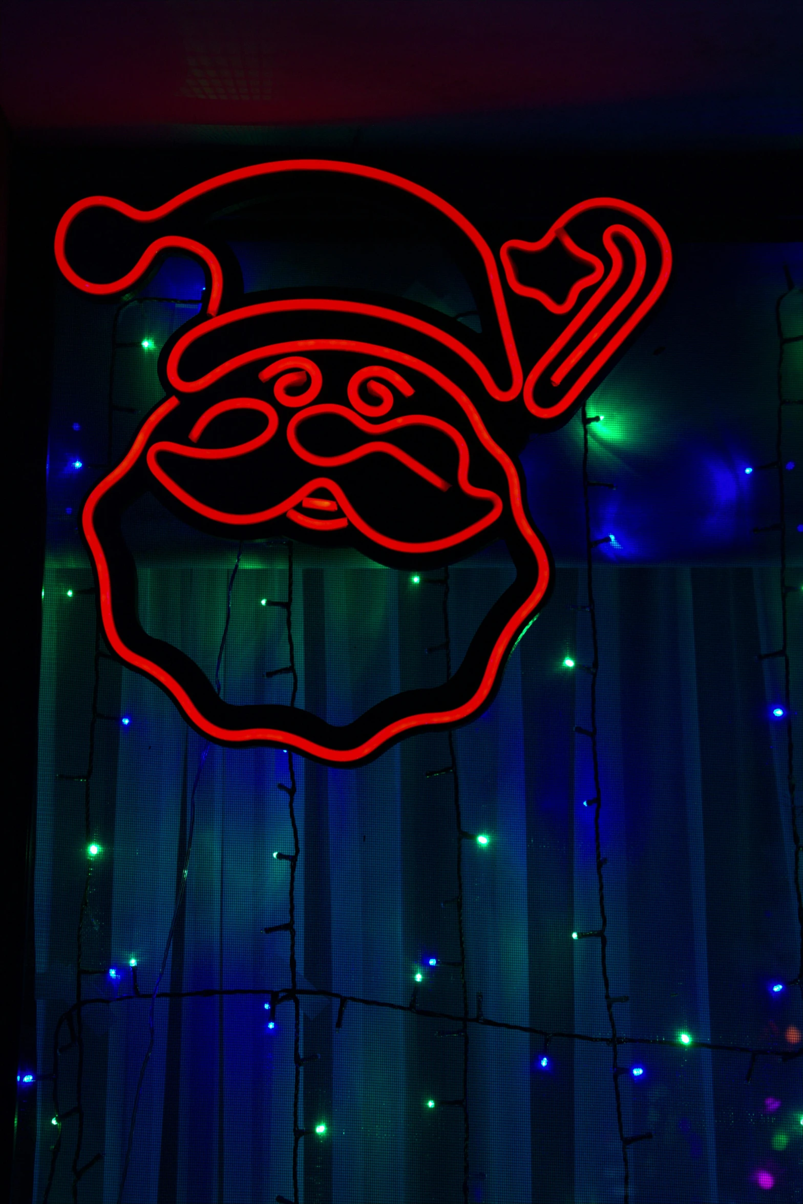 a close up of a neon sign in front of a window, by Bernie D’Andrea, santa clause, hight decorated, f/2