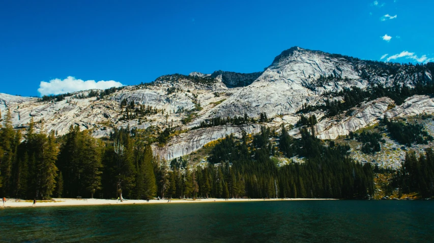 a body of water with a mountain in the background, a photo, pine forests, clear blue skies, yosemite, full res