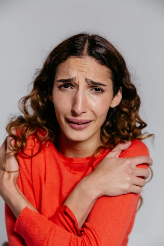 a woman with a concerned look on her face, antipodeans, crying and reaching with her arm, halfbody headshot, promo image, h3h3