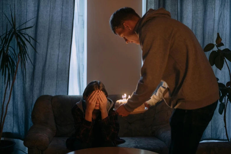 a man lighting a candle on a woman's face, pexels contest winner, hyperrealism, holding a birthday cake, in this ominous scene, heartbroken, teenage girl