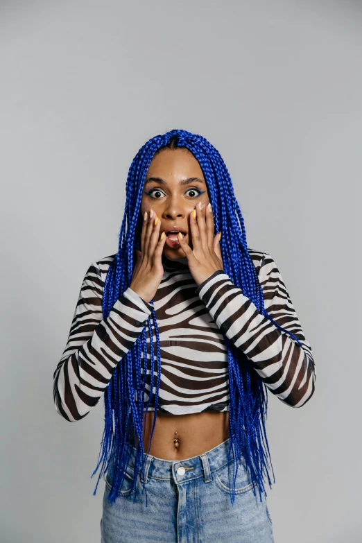 a woman with blue dreadlocks covering her face, trending on pexels, antipodeans, surprised expression, vanessa morgan, hear no evil, wearing a cropped tops