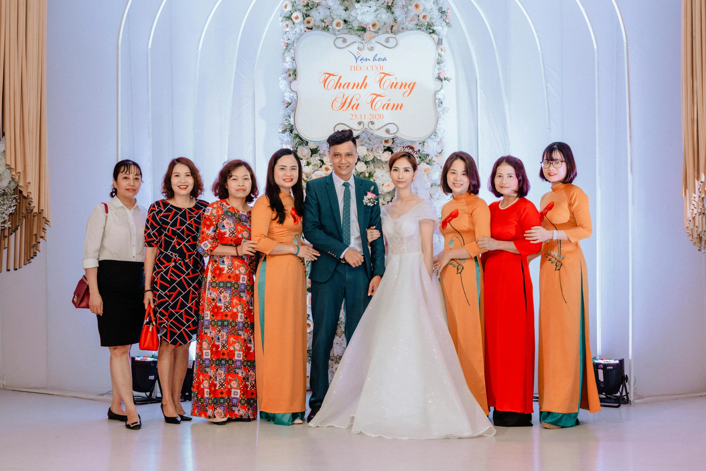 a group of people standing next to each other, ao dai, orange and white color scheme, tiffany style, thumbnail