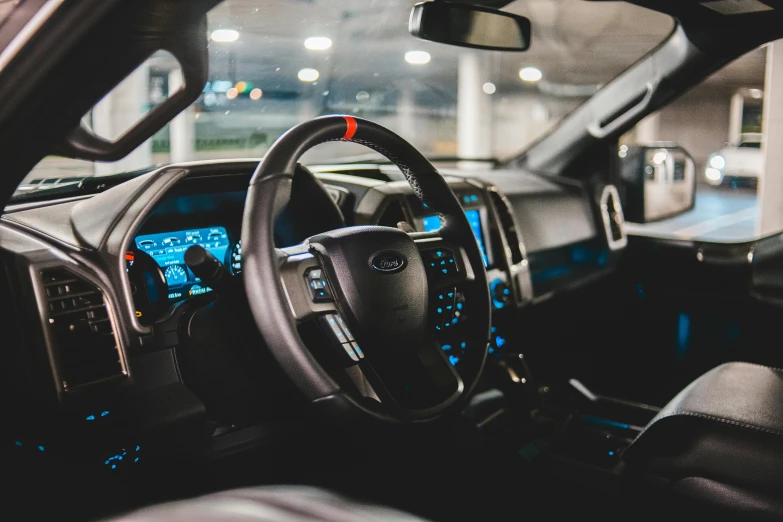 a close up of a car dashboard with a steering wheel, trending on unsplash, les automatistes, ford f-150 raptor, inspect in inventory image, thumbnail, indoor picture