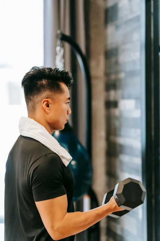 a man working out with dumbbells in a gym, by Robbie Trevino, pexels contest winner, ross tran and bayard wu, looking in mirror, side profile centered, inspect in inventory image