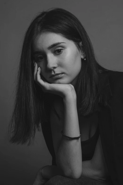 a black and white photo of a woman, inspired by irakli nadar, pokimane, she's sad, professional photoshoot, ((portrait))