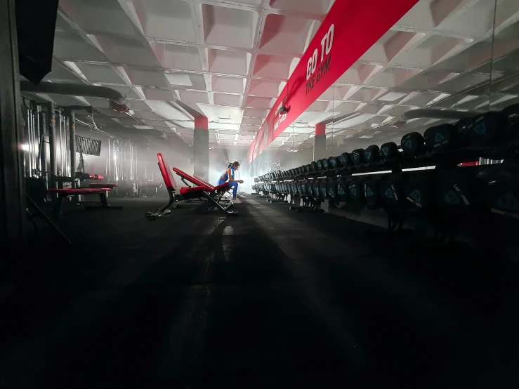 a bunch of chairs that are in a room, a picture, red glow, lifting weights, formula 1 garage, profile image