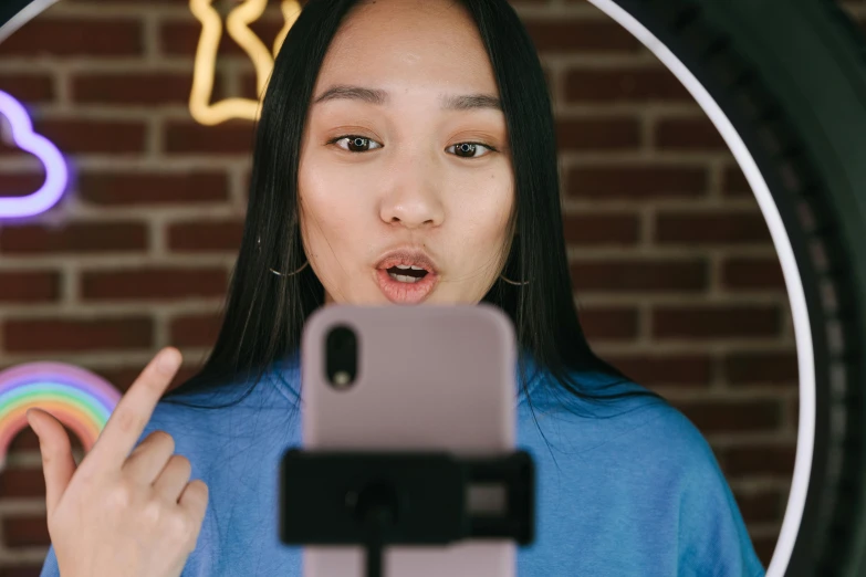 a woman taking a selfie in front of a mirror, trending on pexels, realism, asian face, twitch emote, ring light, avatar image
