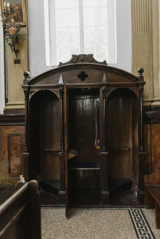 a wooden bench sitting in a room next to a window, by Christopher Wren, containing a hidden portal, alter, thumbnail, a high angle shot