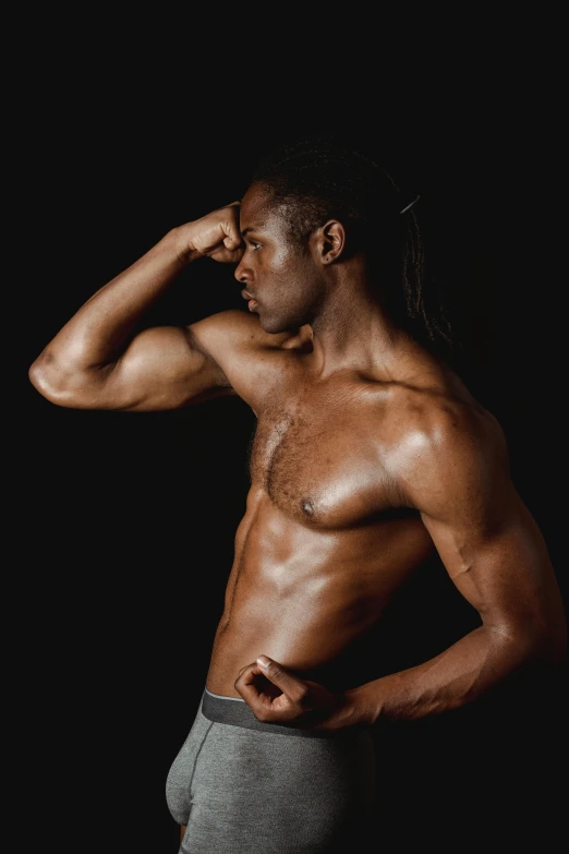 a shirtless man standing in front of a black background, inspired by Terrell James, profile image, man turning into pony, instagram photo, flexing